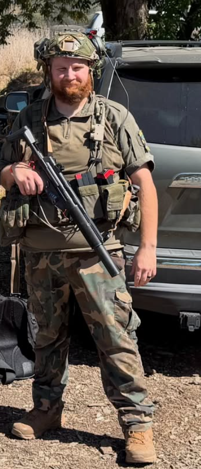 Scott of Mike Force Irregulars in airsoft kit with helmet and rifle at a Pacific Northwest field